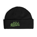 Front view of the oryggy Originals Beanie, a black wide ribbed knit cuff hat featuring high-contrast neon green embroidered graffiti artwork on the center front.
