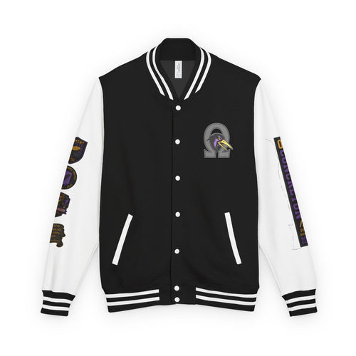 oryggy OC Concreton varsity jacket in Jet Black and Arctic White, featuring a massive Ω tapir patch on the left chest and a gothic Pancho Hawks quote on the right.