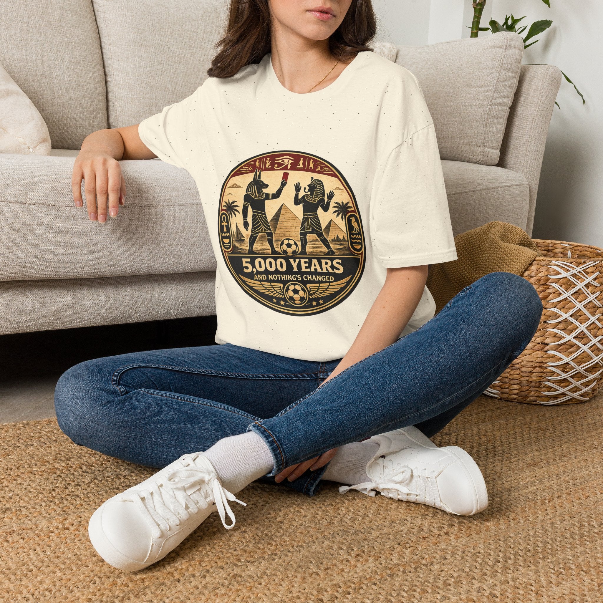 Lifestyle model wearing the streetwear style oryggy Ancient Egypt FIFA 2026 t-shirt with jeans